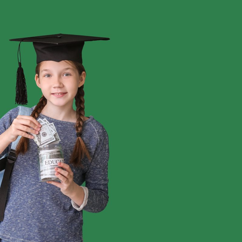 Girl with savings for education on color background